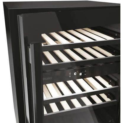 Haier wine cooler with a black glass door, interior shelves, and a digital control panel, shown on a white background.