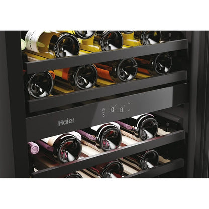 Haier wine cooler with bottles inside on a white background