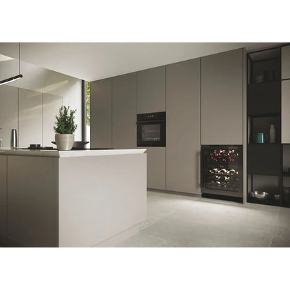 Modern kitchen with gray cabinets, white island, and wine rack.